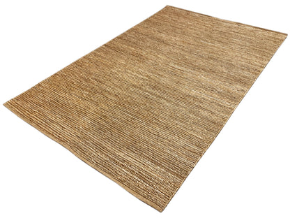 Rectangular sand-beige rug with a marled woven look and dense surface