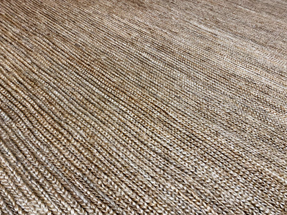 Close-up view of the carpet surface with fine horizontal and vertical lines