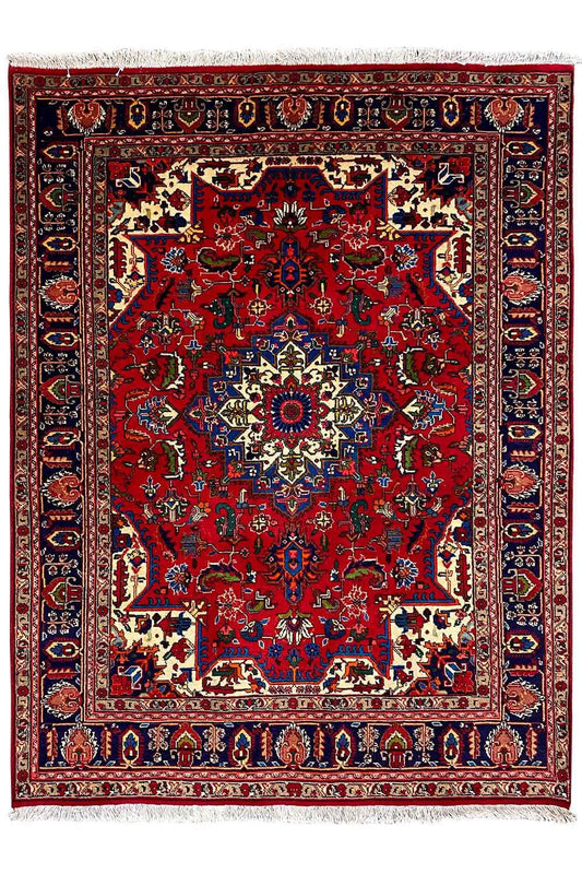 Red carpet with large ornamental fields, blue border, and central medallion