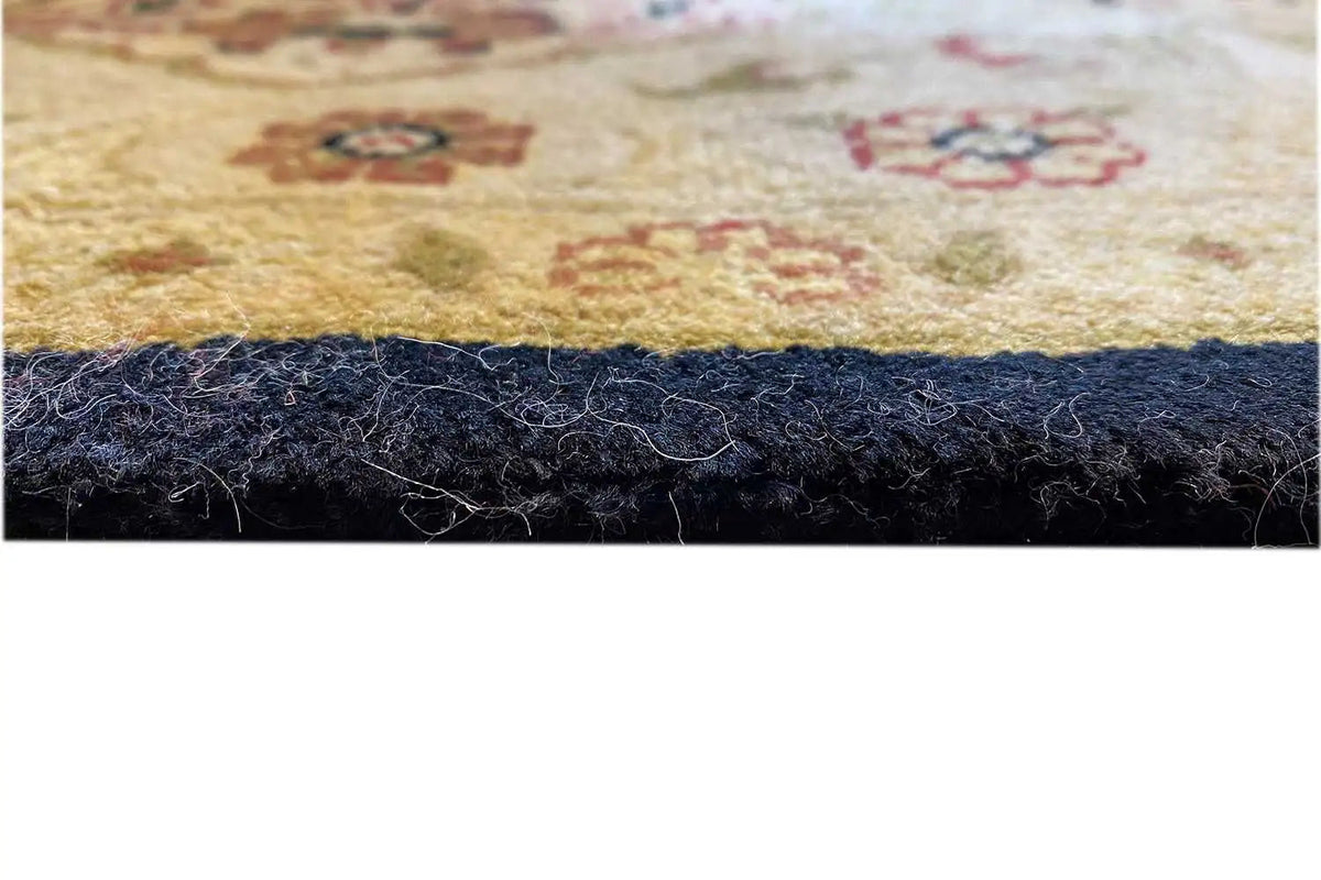 Carpet edge with pile underside and dark fringe trim, fine relief