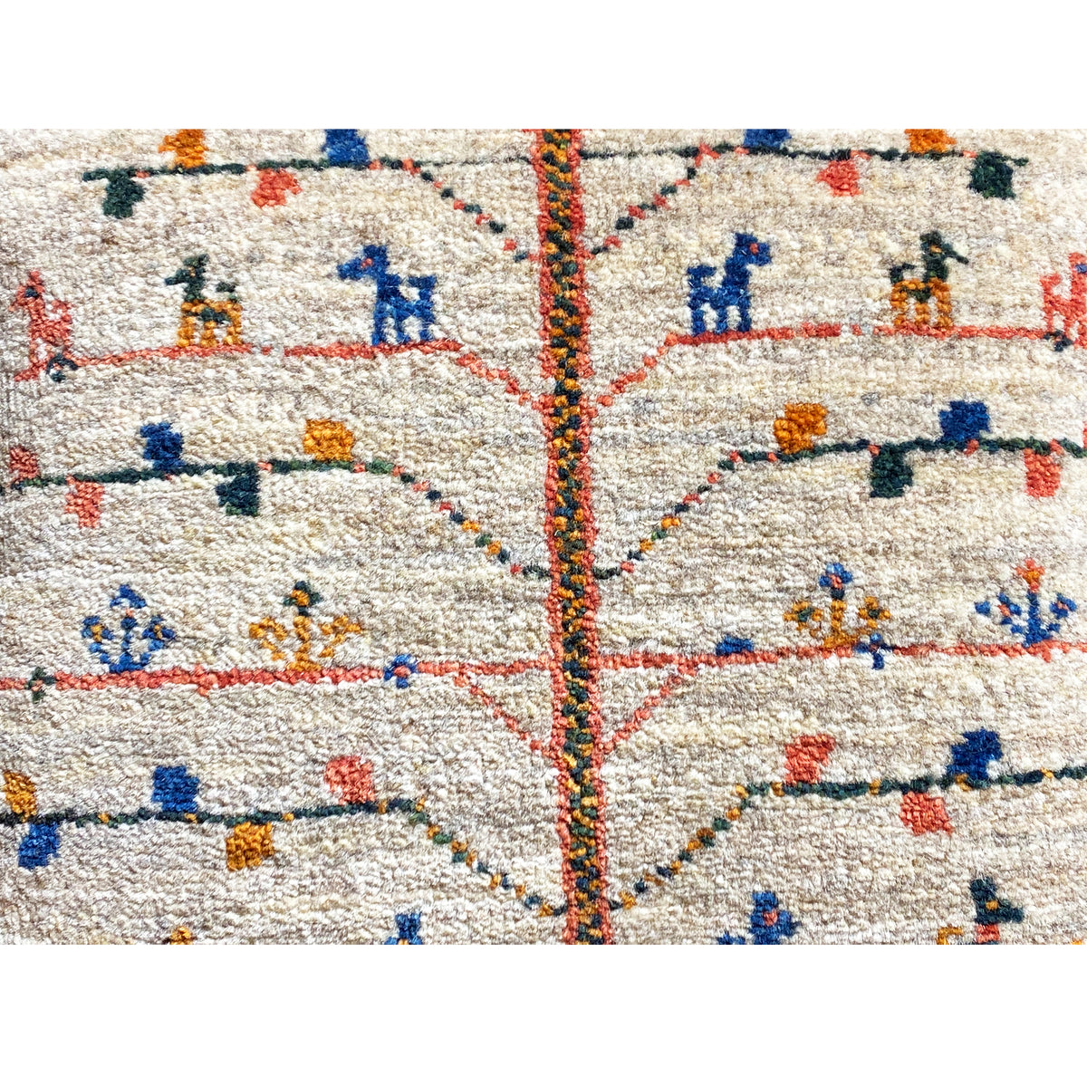 Close-up: beige cushion 40x40 cm with colorful embroidery and center seam
