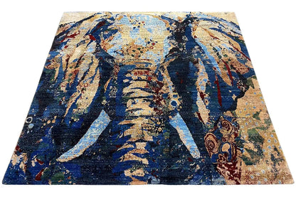 Gabbeh Lori rug with a blue, gold, and beige abstract pattern, angled