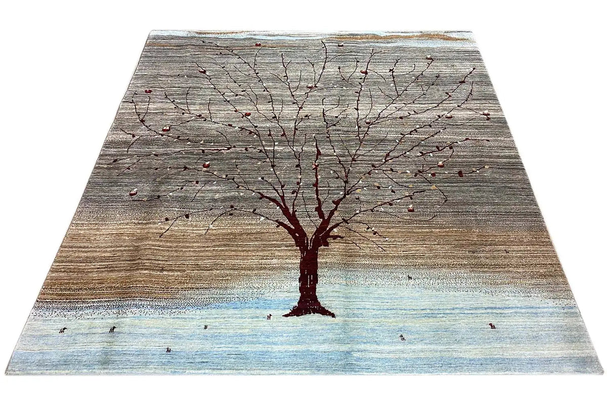 Gabbeh rug with a tree and red branches, gray-brown, light blue border.