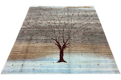 Gabbeh rug with a tree and red branches, gray-brown, light blue border.