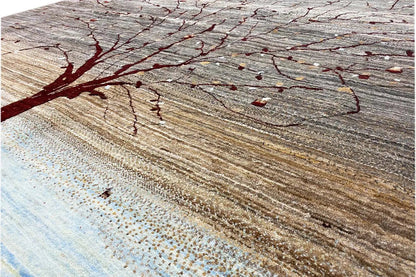 Close-up of a Gabbeh rug: red branches and dots on a gray-brown background.