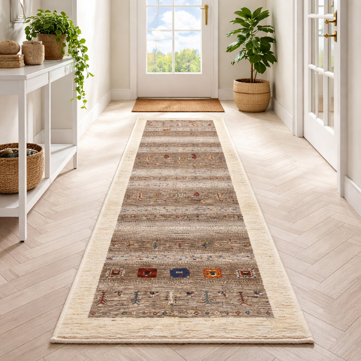 Gabbeh runner rug with a beige border, brown-gray pattern, and colorful decorative elements
