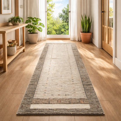 Gabbeh runner rug lengthwise in the room, light central area with dark brown side edges