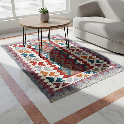 Colorful rectangular kilim rug, geometric pattern with fringes on a light background