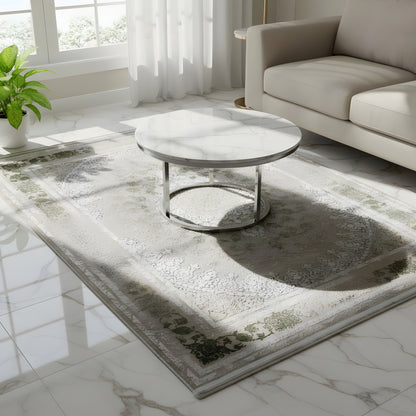 Rectangular rug with silver and cream ornamentation and green decorative areas