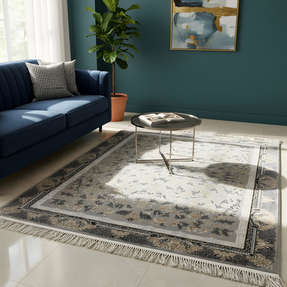 Gray-beige medallion rug with a floral pattern, border, and fringe