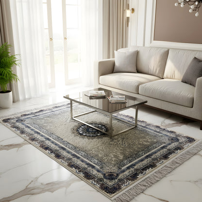Rectangular medallion rug on a light-colored floor with a beige pattern and dark blue border