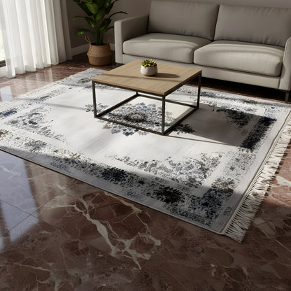 Medallion rug with an ornamental pattern, light gray background, blue and gold details, and fringe