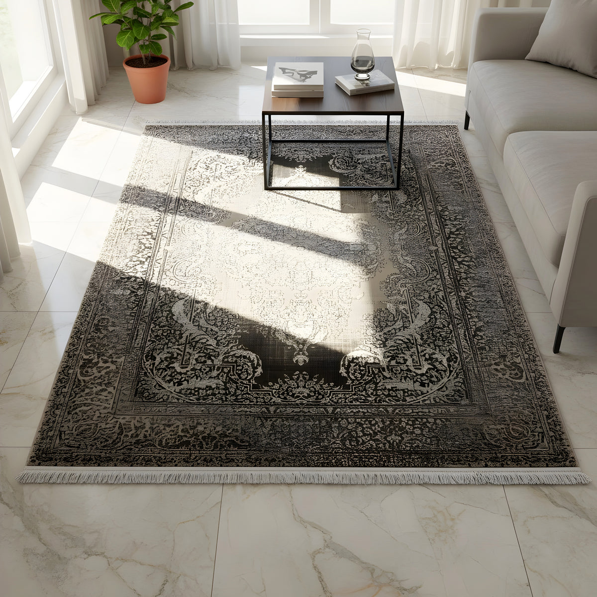 Rectangular dark gray/beige rug with a Baroque ornamental pattern, laid folded
