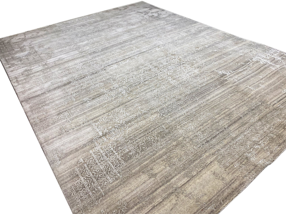 Beige rug with a light ornamental field and an even line pattern across the surface