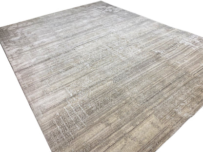 Beige rug with a light ornamental field and an even line pattern across the surface