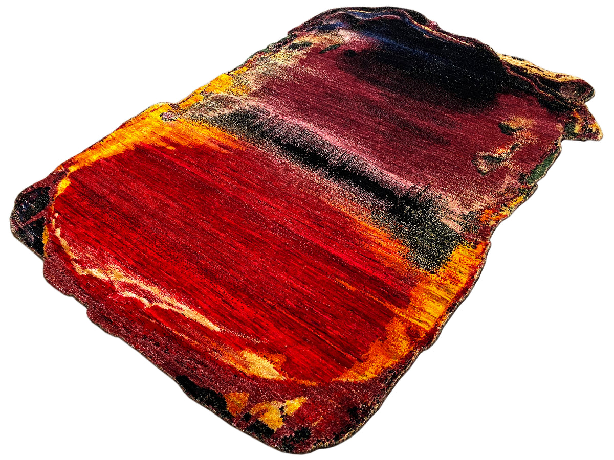 Designer rug in red with an orange-yellow gradient and dark areas, wavy edges