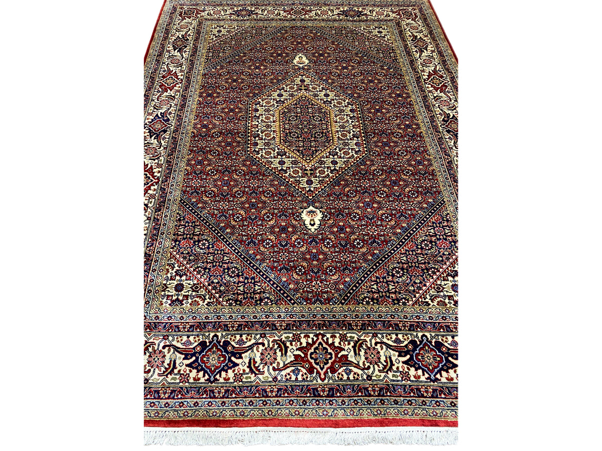 Red Bidjar rug with a centered medallion and ornamental border pattern