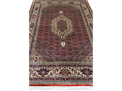 Red Bidjar rug with a centered medallion and ornamental border pattern