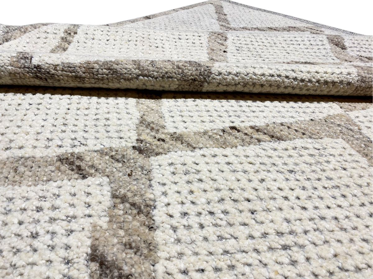 Berber rug close-up: beige geometric pattern, thick pile, multicolored