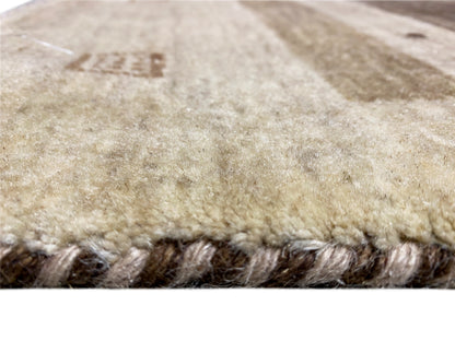 Beige carpet pile, short fibers with a dark bound edge