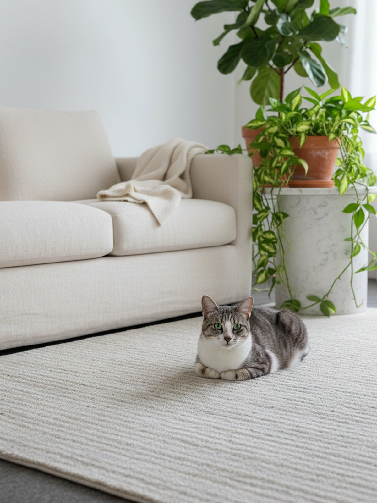 Beige low-pile rug with a mottled, all-over pattern