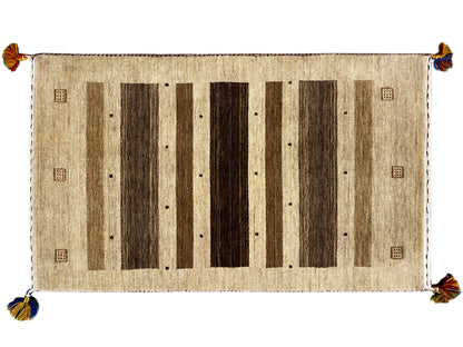 Gabbeh rug 120×68 cm with a beige background, dark vertical stripes, and corner tassels