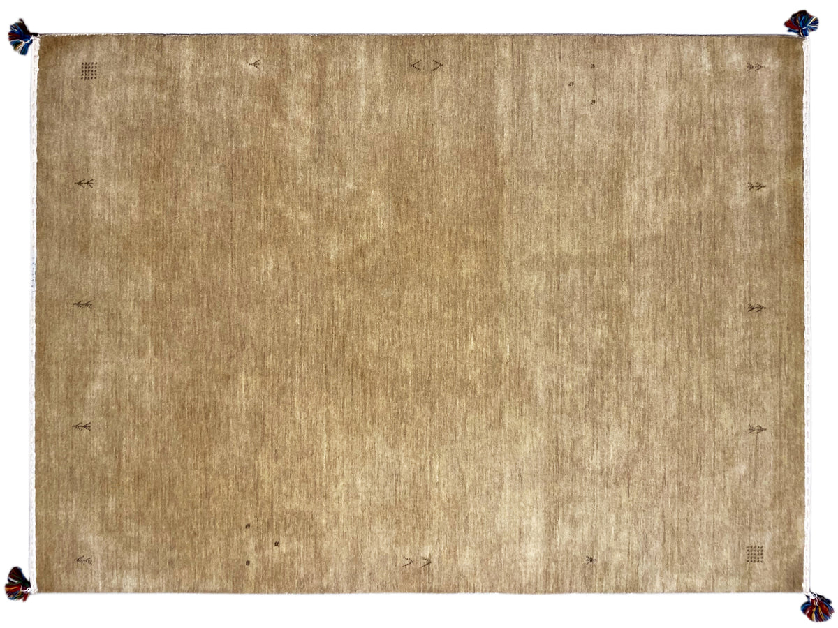 Light brown Gabbeh rug with a white border and blue tassels at the corners