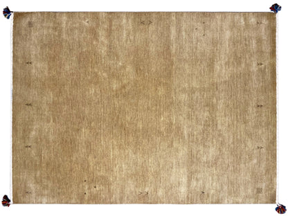 Light brown Gabbeh rug with a white border and blue tassels at the corners