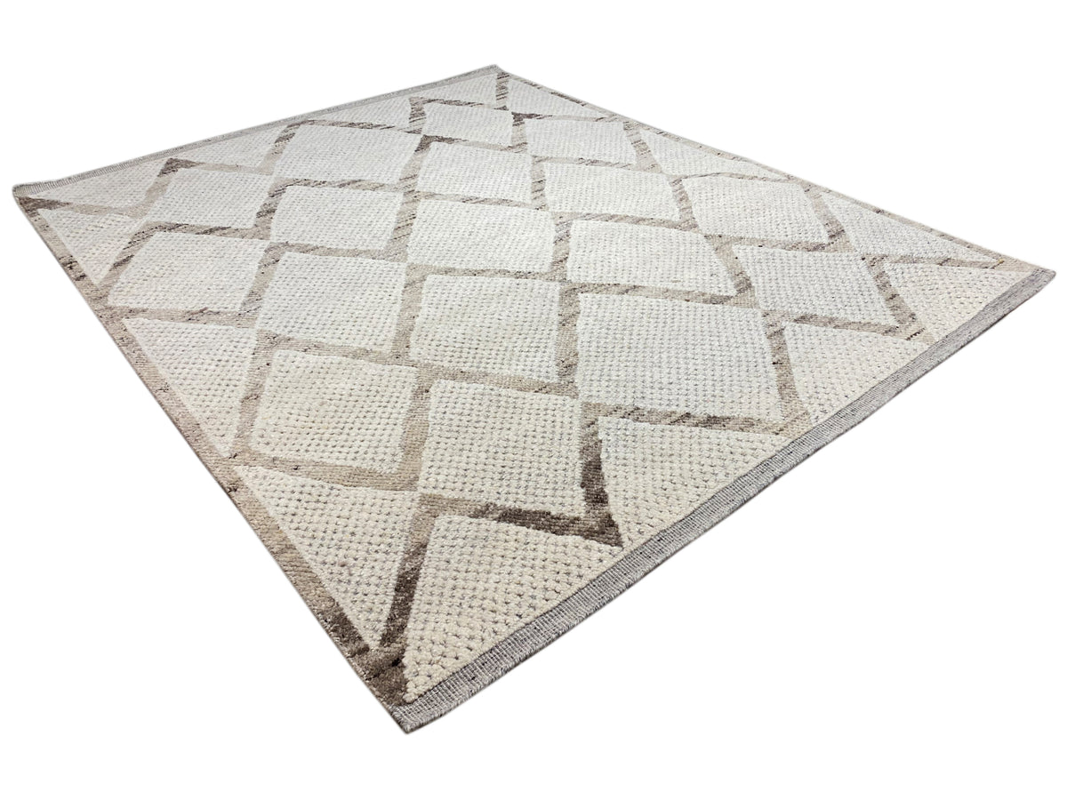 Berber rug with a square design featuring beige and gray cubes in the border