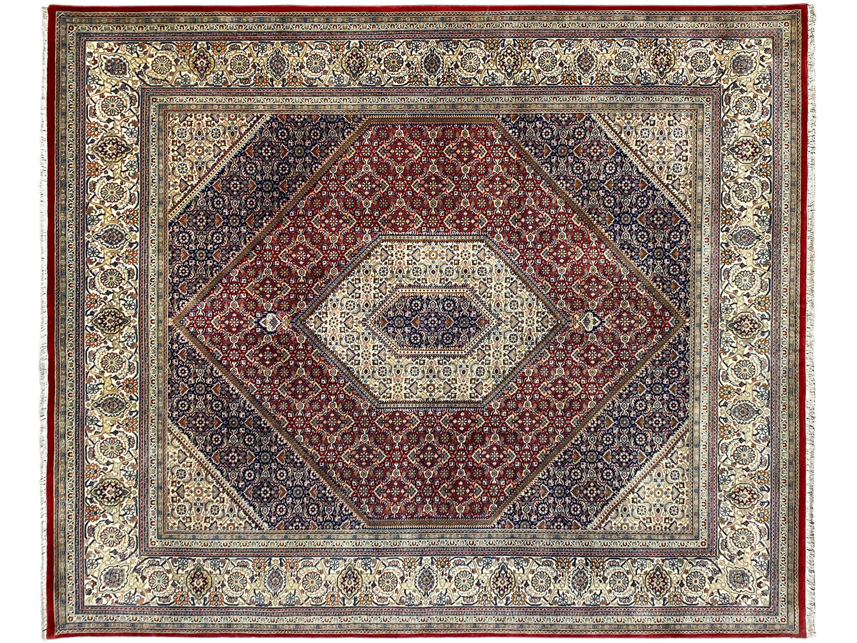 Bidjar rug with central medallion and surrounding border, red, blue, and cream