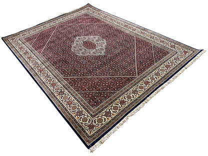 Rug with diagonal lines in the pattern, central medallion, and dark borders