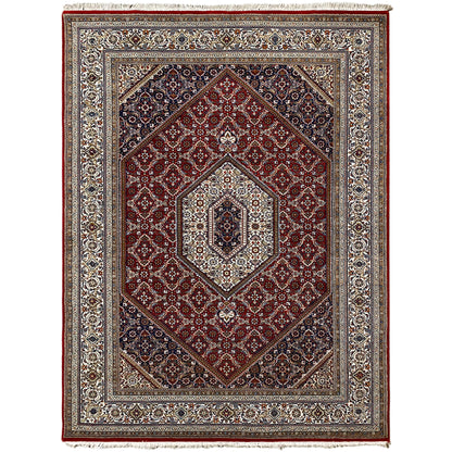 Carpet with a red background, blue border pattern, and light medallion in the center