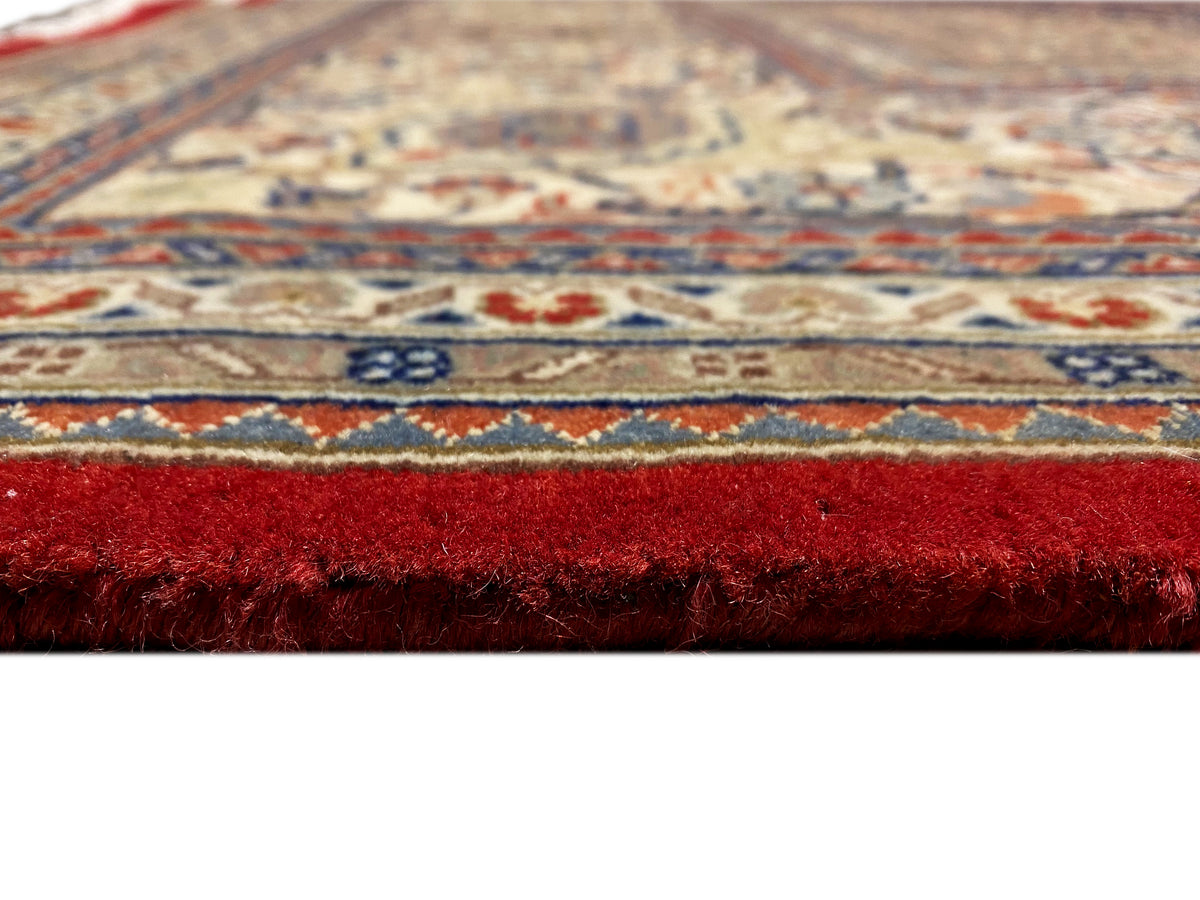 Bidjar rug with a red border, fine pile, and detailed geometric pattern