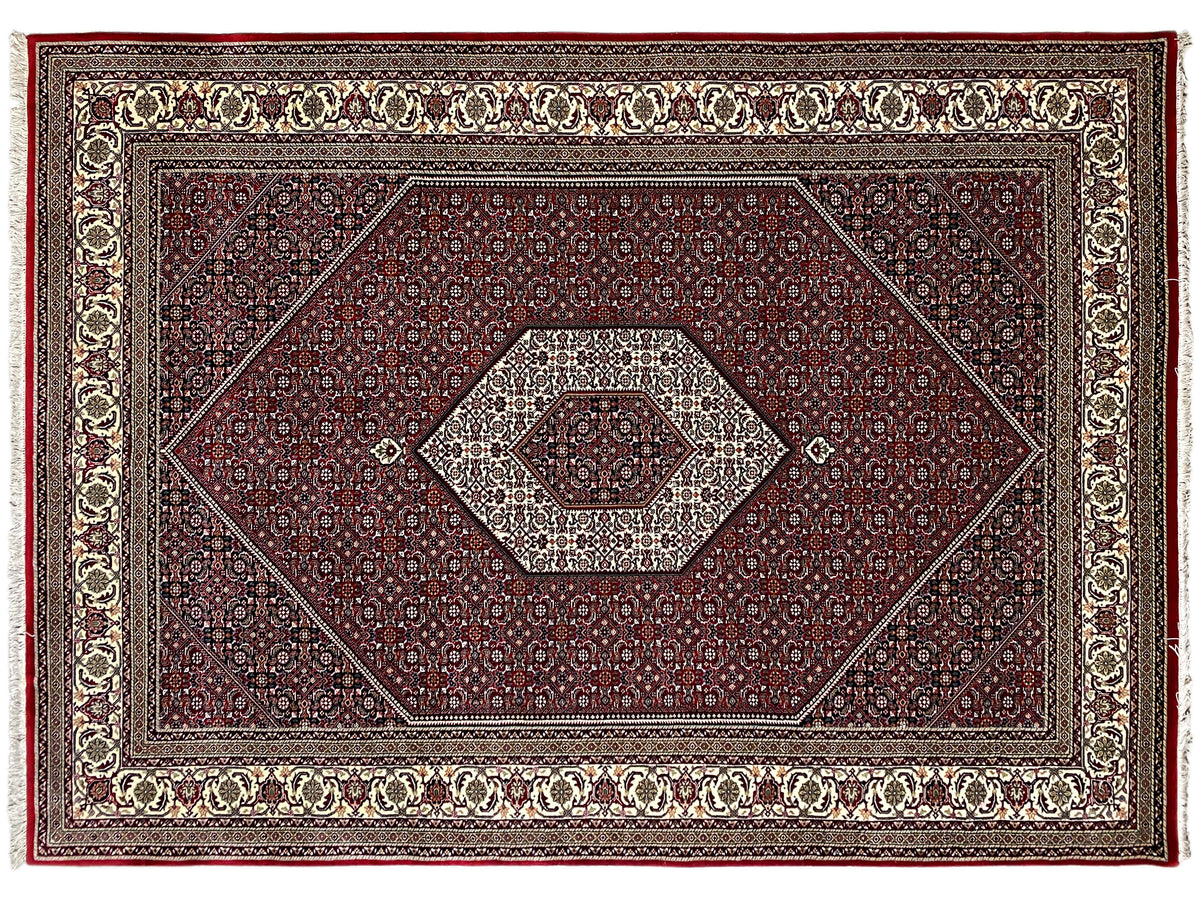 Bidjar carpet front view: dark red, ornamental border, and beige central medallion