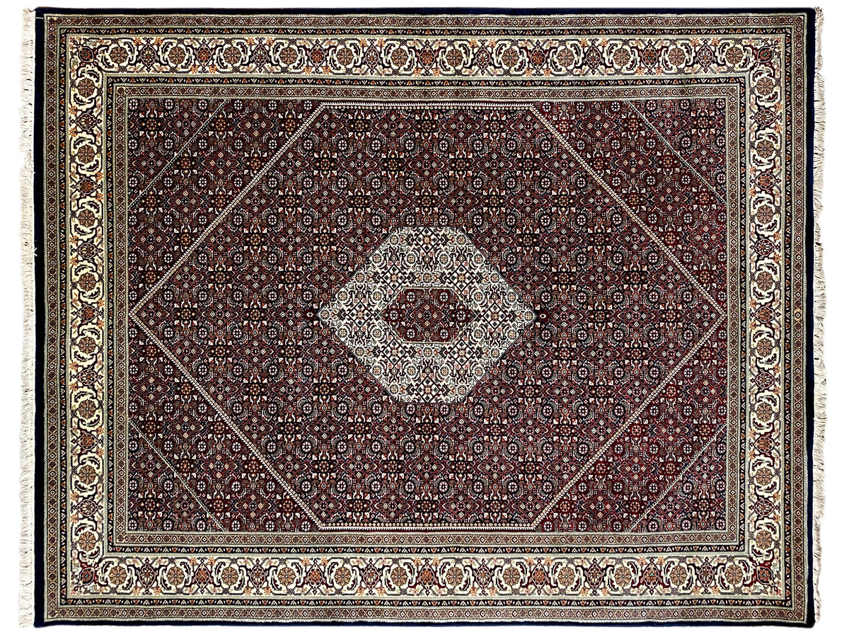 Frontal view of a Bidjar rug with a central medallion and richly decorated border