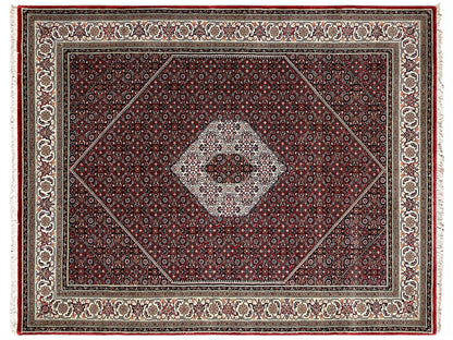 Bidjar rug viewed from above: reddish-brown central medallion with a fine cream-colored border