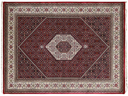 Red Bidjar rug with a geometric pattern and border in cream and dark blue