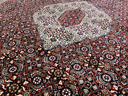 Rug with numerous small motifs in red, blue, cream, and dark blue