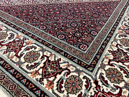 Bidjar carpet: diagonally running borders, dark red with cream-colored accents