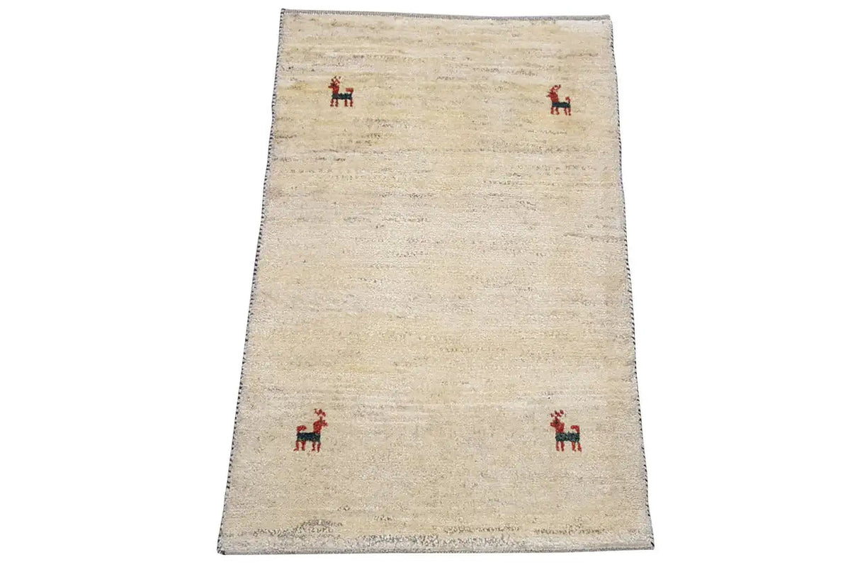 Gabbeh rug 96x60 cm: beige rug with a few red animal motifs