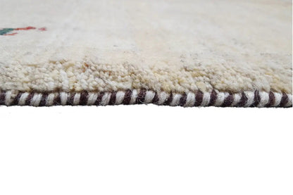 Close-up: beige carpet with a dense pile and a brown-and-black striped border