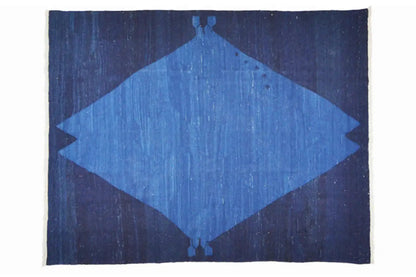 Rug with blue diamond pattern and dark background, rectangular
