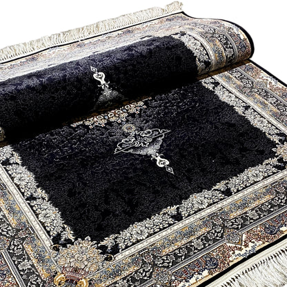 Black rolled-up carpet with ornaments, borders, and medallion design