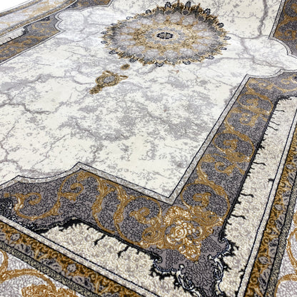Carpet detail: circular medallion in gold and dark tones on a light background