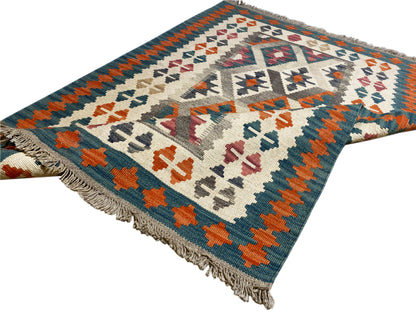 Kilim rug with colorful geometric patterns and a wide border, fringes along the edge