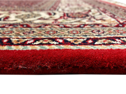 Bidjar carpet with a deep red ground, ornamental medallion, and cream-colored borders