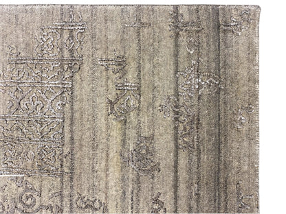 Detail view: Gray designer rug with light ornaments and an aged texture