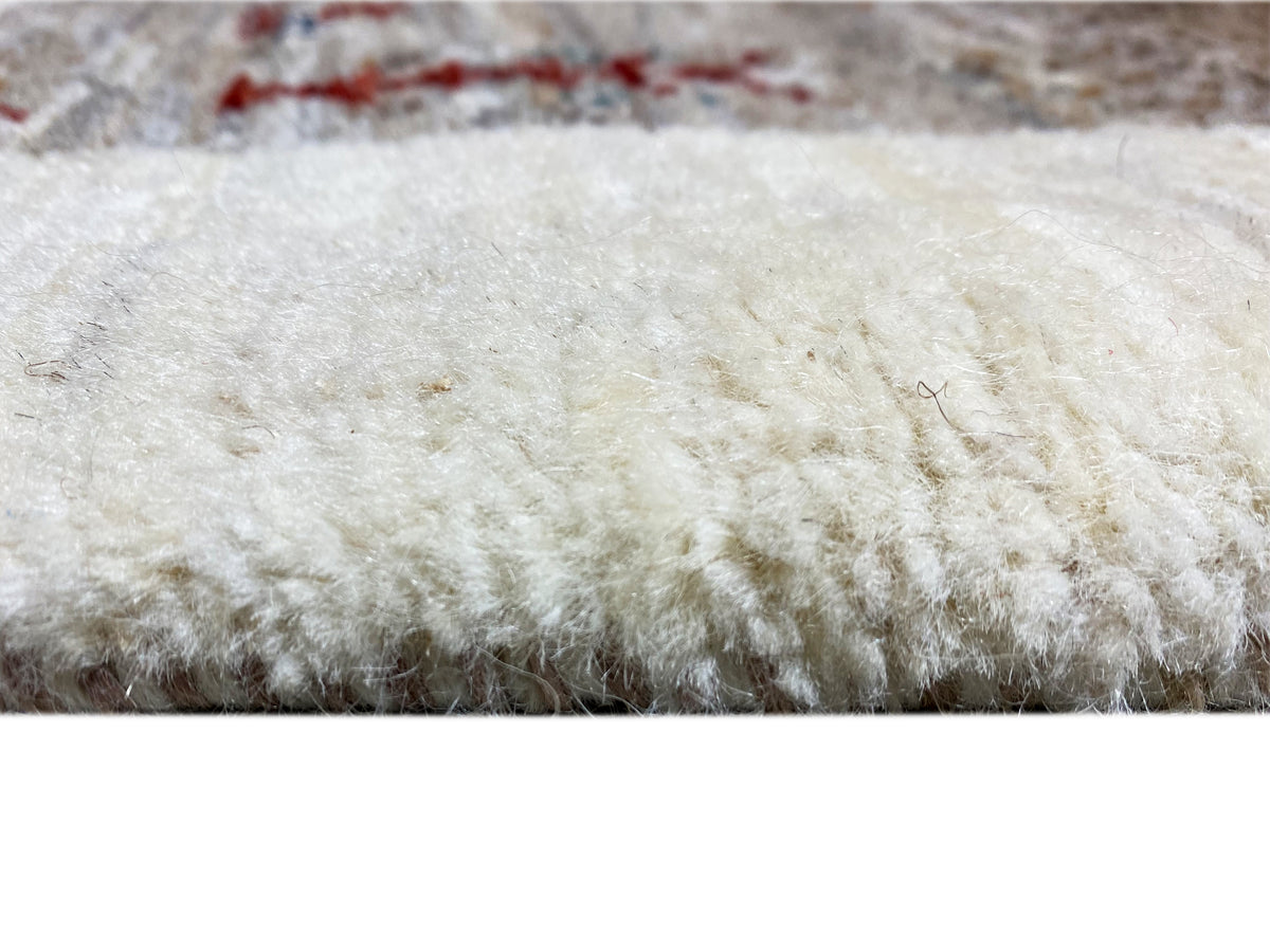 Gabbeh runner rug with a light pile and fine, darker fiber patterns