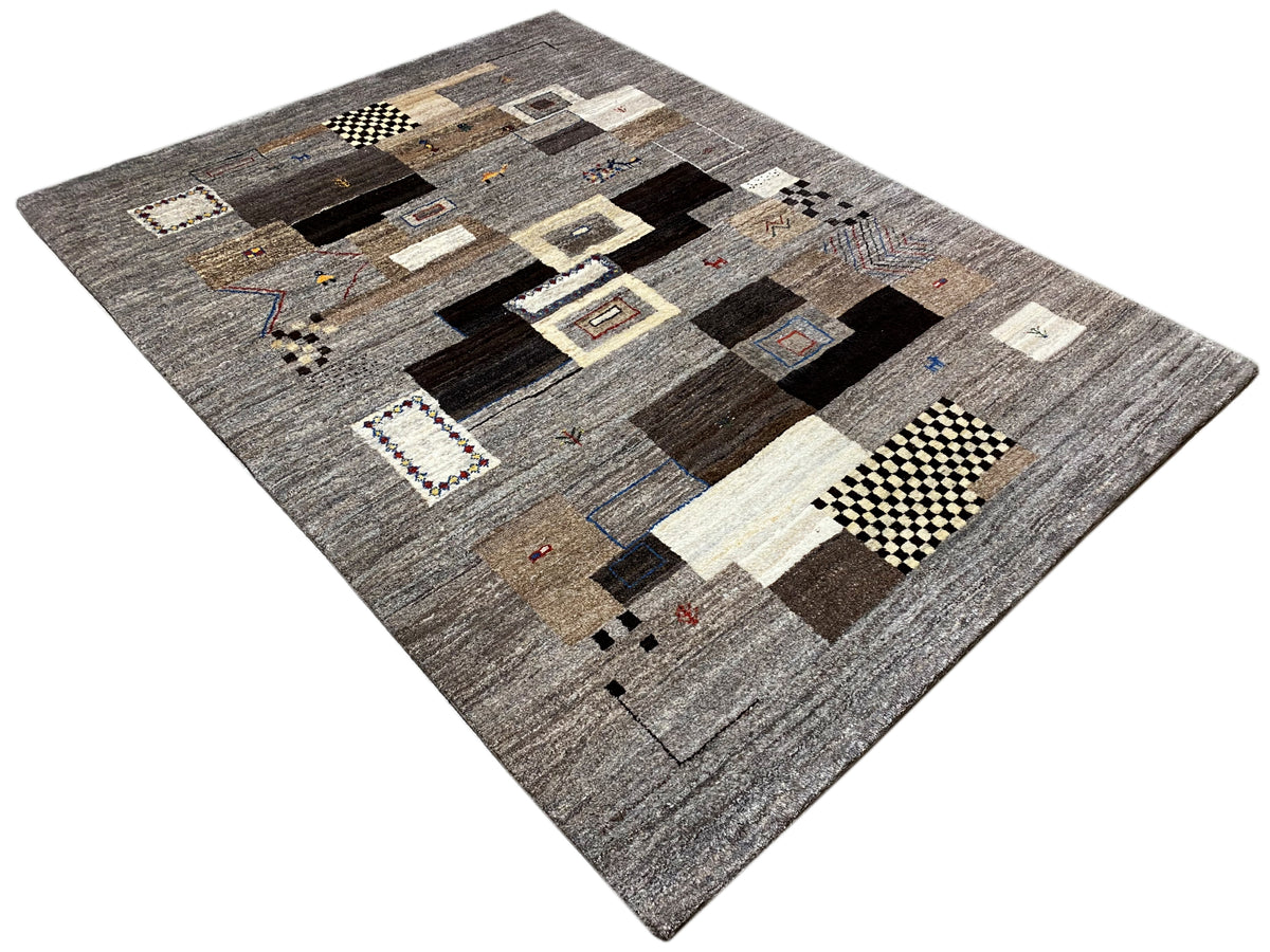 Gabbeh rug 235x171 cm with a gray-brown geometric patchwork pattern