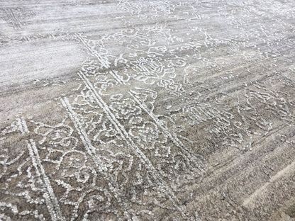 Beige rug with a detailed ornamental relief of light pattern lines